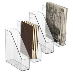 four clear acrylic books are lined up in a row with the covers folded down