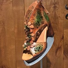 there is a shoe that has been made to look like it's being displayed