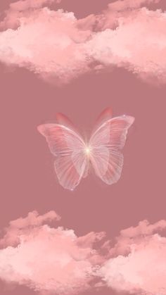 a white butterfly flying through the air with pink clouds in the backgrounnd