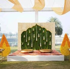 Embrace the traditional South Indian wedding aesthetic by incorporating lush banana leaves as the primary décor element for your Haldi ceremony. Complement the green foliage with garlands of tuberose and marigold flowers for a truly authentic and captivating ambiance. Nalugu Backdrop, Decoration Ideas For Haldi, Mehendi Stage, Leaf Decoration Ideas, Haldi Theme, Simple Crib, Haldi Celebration, Thread Ceremony, Banana Leaf Decor