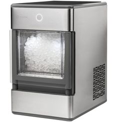 an ice machine is shown with the door open