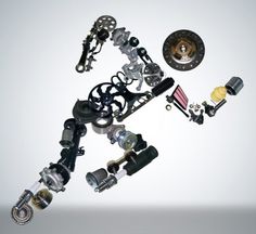 an assortment of different types and sizes of motor parts in the shape of a dog