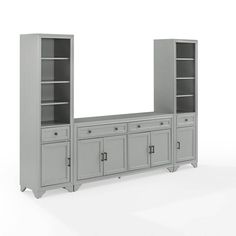 a gray bookcase with two doors and three cupboards on one side, an open door to the other