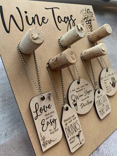 wine tags are hanging from corks on a card