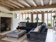 a living room filled with furniture and a fire place