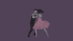 two people are dancing in the dark with their arms around each other