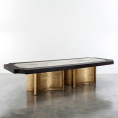 the brass and marble coffee table is on display in an empty room with text that reads brussel's pedestal table