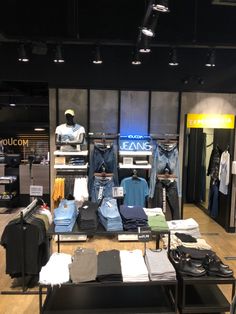 a clothing store with clothes on display