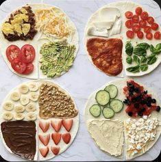 several plates with different types of food on them, all arranged in the shape of hearts