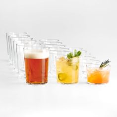 there are many glasses with different drinks in them