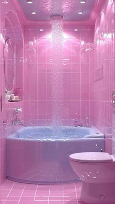 a pink bathroom with a tub, toilet and sink in the center is illuminated by lights