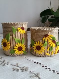 two baskets with sunflowers are sitting on a table