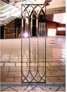 an empty room with some glass doors on the floor