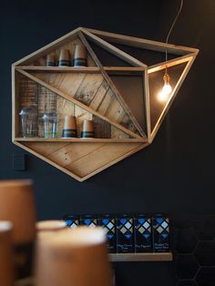 an instagramted photo with the caption'i like this design part of me would love it all shelves were geometric these are from hulula cafe in n2ahes wood