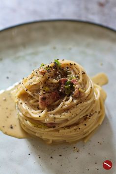 a plate with some pasta and sauce on it