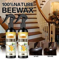 two bottles of beewax sitting next to each other on a stair case with stairs in the background