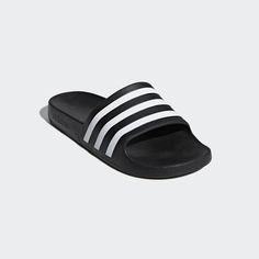 POST-SWIM SLIDES WITH ENHANCED CUSHIONING. Rinse off after the pool in these shower-friendly sandals. Keeping it simple, the smooth slip-ons reveal their adidas DNA with signature 3-Stripes. DETAILS Colour: Black/White Stripes Regular fit Slip-on construction One-piece moulded EVA upper EVA outsole Lightweight feel; Quick-drying material Adidas Slippers, Adidas Sandals, Otaru, Adidas Slides, Boys Sandals, Adidas Adilette, Adidas Sportswear, Best Sneakers, Aquaman