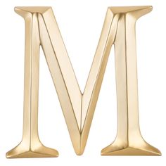 the letter m is made out of gold metal and has two small, slender legs