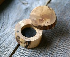 two wooden objects sitting on top of a wooden table