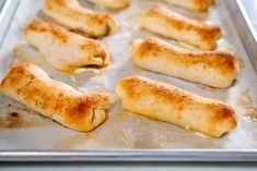 some food that is laying out on a baking sheet and ready to be baked in the oven