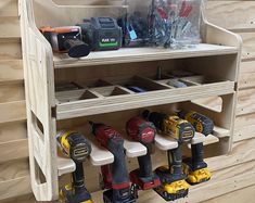 a shelf filled with lots of tools on top of wooden shelves next to each other