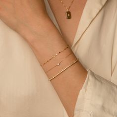 The Twisted Lace Chain Bracelet is an absolute must-have for your wrist. It’s dainty and adds just the right amount of feminine sparkle you have been looking for. If you’re looking for a bracelet you can wear every day - you've found it! It looks amazing on its own and dainty enough to pair with your other favorite bracelets. Crafted of 14k solid gold so you can wear it 24/7 - even to the gym, shower, and to sleep. This bracelet is a sparkly treasure that you'll never want to take off! DETAILS 1