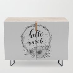 an image of a cabinet with the words hello march written on it and flowers around it