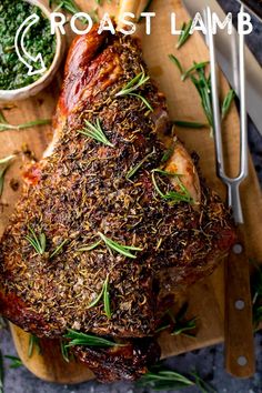 roast lamb with herbs and seasoning on a cutting board