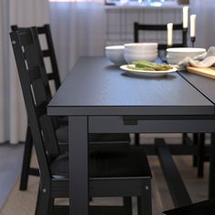 a dining table with plates of food on it