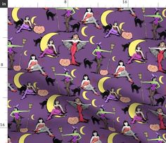 a purple background with black and white cats, witches, and pumpkins on it