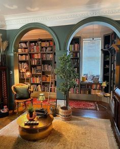 a living room filled with furniture and bookshelves