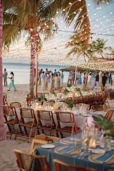 an outdoor wedding reception on the beach