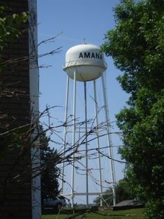 a water tower with the name amana on it