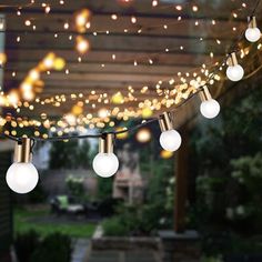 outdoor string lights are hanging from the ceiling