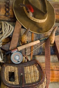 an image of fishing gear on display in a white framed photo with rope and hooks