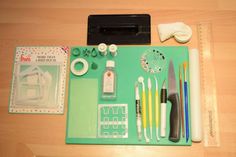 crafting supplies laid out on top of a wooden table