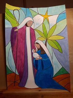 a stained glass nativity scene depicting the birth of jesus