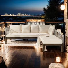 a white couch sitting on top of a wooden floor next to a fire hydrant