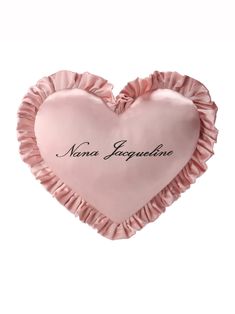 a pink heart shaped pillow with the name nanna jaquestone written on it