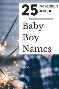 a baby boy is holding sparklers with the words 25 incredibly unique baby boy names