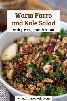 a white bowl filled with farro and kale salad