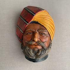 a statue of a man wearing a turban