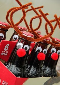 an image of some soda bottles with reindeer noses on them and the caption below