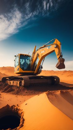 an excavator digging in the sand dunes