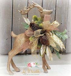 a deer decoration with pine cones on it