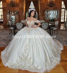 a woman in a ball gown posing for the camera