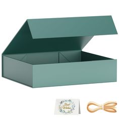 an open box with two pairs of scissors next to it