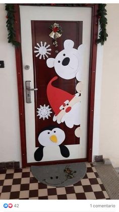 a door decorated with an image of a polar bear and penguin