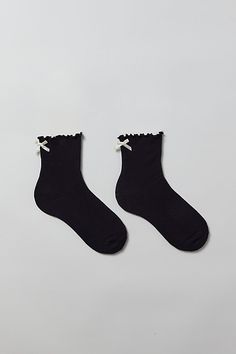 So soft socks in a cozy ribbed knit with a ruffled lettuce edge. Finished with a satin bow at the ankle for an extra-sweet touch. Features Ribbed knit ruffle & bow crew socks So-soft statement socks Cozy-knit crew socks Lettuce edge ruffle along the ankle Satin ribbon bow at the back Content + Care 70% Cotton, 28% polyester, 2% spandex Machine wash Imported Size + Fit Crew sock length Fits US women’s shoe size 6–10 | Ribbed Knit Ruffle & Bow Crew Sock in Black, Women's at Urban Outfitters Socks Ruffle, Statement Socks, Ruffled Socks, Soft Socks, Satin Ribbon Bow, Xmas List, Soft Sock, Crew Sock, Black Socks