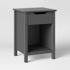 a small gray nightstand with one drawer open